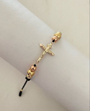 Pulsera Cruz con balines #4 y #5 lisos y diamantados en tonos rosa y dorados